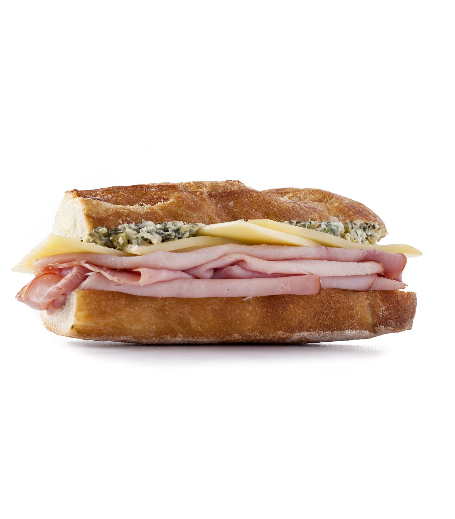 Side View of French Ham and Cheese Sandwich, with Layers of Ham, GruyÃ¨re Cheese, and a cornichons, butter, Dijon mustard, and tarragon spread