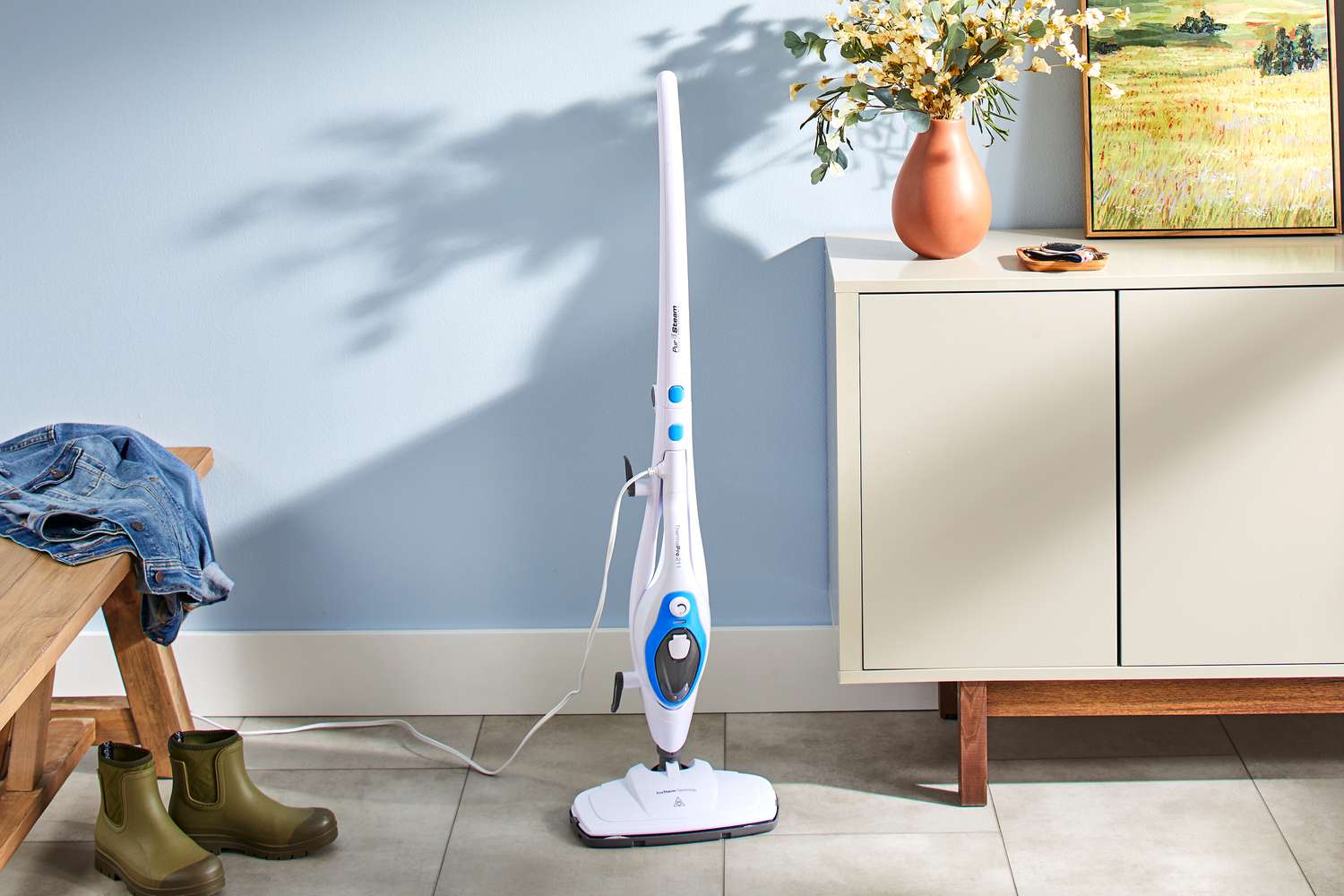 PurSteam 10-in-1 Steam Mop displayed next to a cabinet on a tile floor