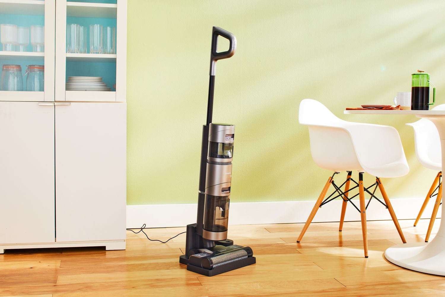 Dreametech H11 Max Wet and Dry Vacuum on a wooden floor next to furniture