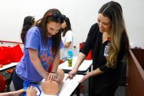 Yvonne James, a registered nurse at UMC, right, supervises as Evelyn Vasquez applies pressure t ...