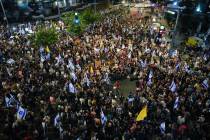 People attend a rally demanding a cease-fire deal and the immediate release of hostages held by ...