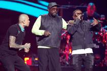 From left, Taboo, will.i.am and apl.de.ap of The Black Eyed Peas perform on the first night of ...