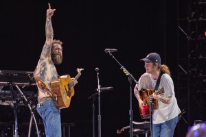 MANCHESTER, TENNESSEE - JUNE 14: (L-R) Post Malone and Billy Strings perform during the 2024 Bonnaroo Music and Arts Festival on June 14, 2024 in Manchester, Tennessee. (Photo by Douglas Mason/WireImage)