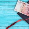 Graduate cap and fifty pound note