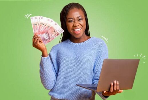 woman with money and a laptop