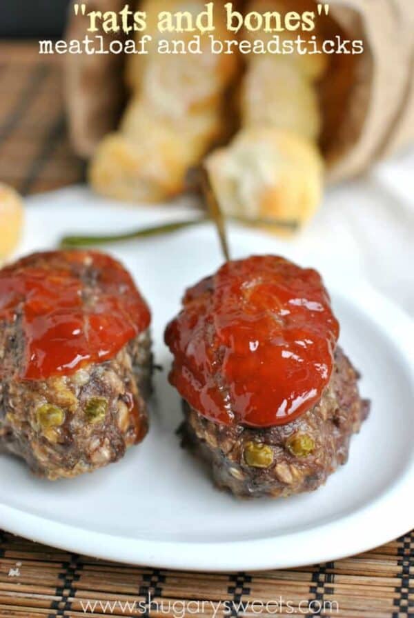 Meatloaf "rats". Delicious flavorful meatloaf for April Fools Day. Topped with a homemade sweet and tangy "blood" sauce, beady eyes and tails. #aprilfoolsday 