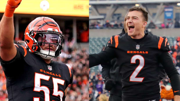 Bengals linebacker Logan Wilson celebrates a win. Bengals kicker Evan McPherson celebrates a win.