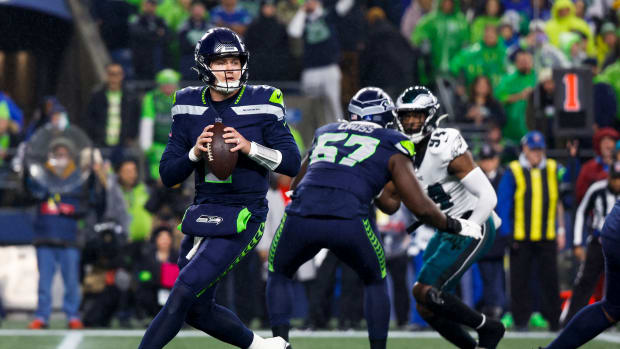 Dec 18, 2023; Seattle, Washington, USA; Seattle Seahawks quarterback Drew Lock (2) looks to pass against the Philadelphia Eagles during the first quarter at Lumen Field. Mandatory Credit: Joe Nicholson-USA TODAY Sports