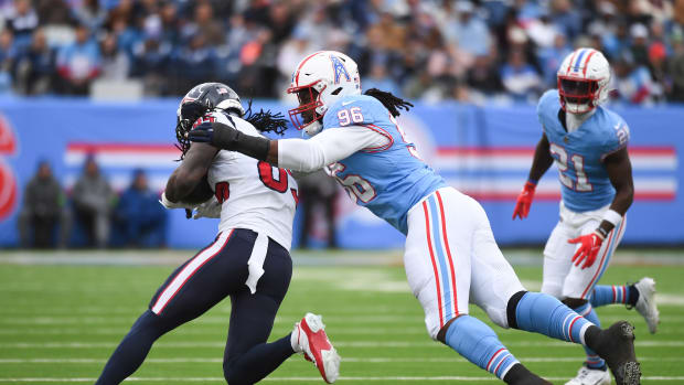 Texans wide receiver Noah Brown (85) is tackled by Tennessee Titans defensive end Denico Autry (96) during the first half at Nissan Stadium.