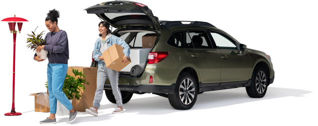 A mother and daughter unload plants and boxes from their SUV into their new home.