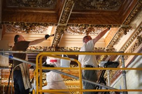 Conservators Staszek Kotowski, left and Brad Stewart work on restoring the original Jamaican Satinwood paneling inside the Dinning Room at the Flagler Museum in Palm Beach on Wednesday, Aug. 7, 2024. The museum is doing a meticulous restoration of the original dining room. Designed in the Henri IV style, it reflects the tastes of affluent French society during the reign of Louis Napoléon. (Carline Jean/South Florida Sun Sentinel)