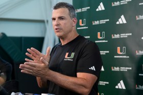 Hurricanes coach Mario Cristobal, shown speaking to the media on July 31, said the offense outperformed the defense in Miami's first fall scrimmage on Saturday. (AP Photo/Marta Lavandier)