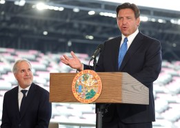 Inter Miami Managing Owner Jorge Mas, left, smiles up at Gov. Ron DeSantis during a news conference Thursday at Chase Stadium in Fort Lauderdale. (Carline Jean/South Florida Sun Sentinel)