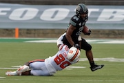 Syracuse defensive back Darian "Duce" Chestnut (20) makes a tackle against Ohio running back De'Montre Tuggle (24 ) during an NCAA college football game, Saturday, Sept. 4, 2021, in Syracuse, N.Y. (N. Scott Trimble/The Post-Standard via AP) AP