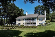 This solid four-bedroom, four-bath-and-a-half Skaneateles Lake home has good bones waiting to be reborn