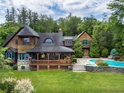 This Skaneateles Lake waterfront estate has 214 feet of frontage, offering panoramic views from the well-built Contemporary home placed perfectly on the lake in such a way that ensures both sunrises and sunsets are visible.