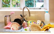 A sink full of dirty dishes. (Getty Images)