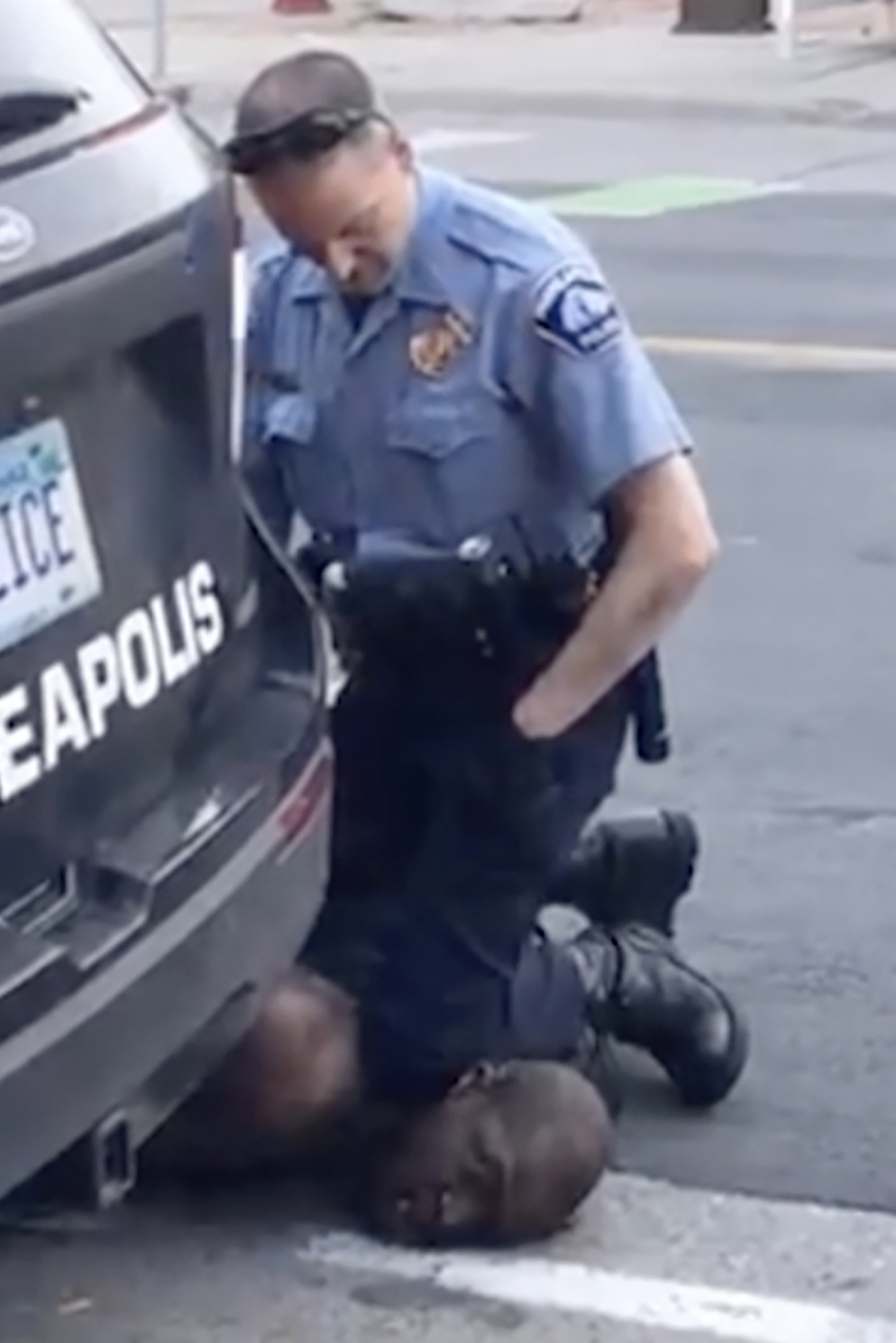  In this Monday, May 25, 2020, frame from a video provided by Darnella Frazier, Derek Chauvin is seen kneeling on top of Floyd