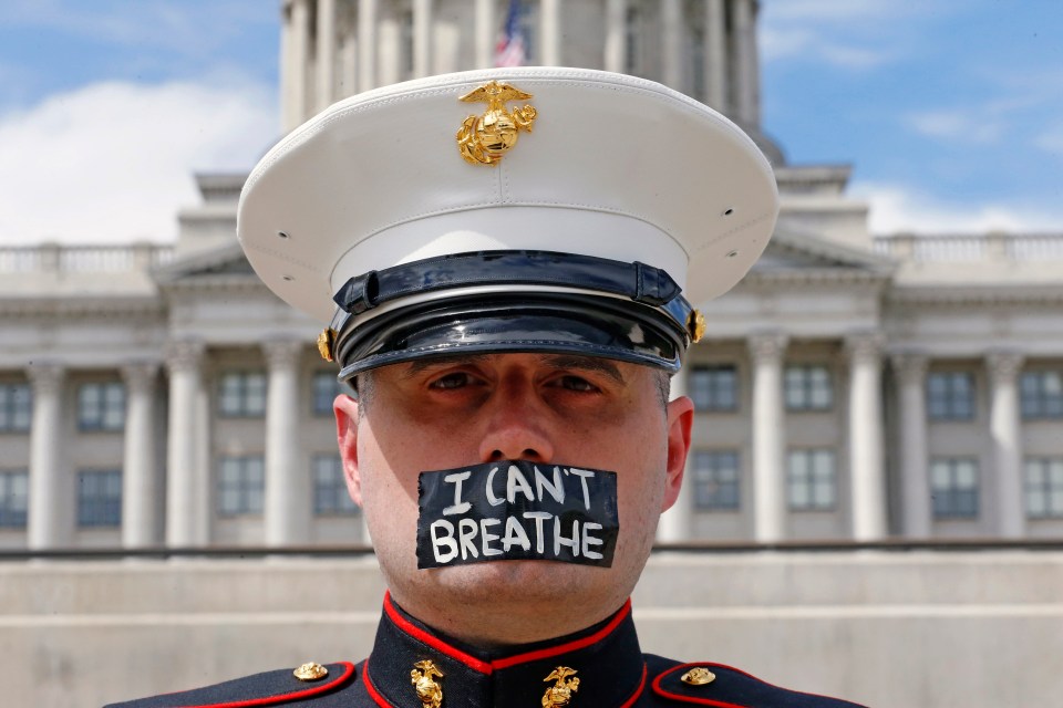  Retired Marine Todd Winn, wearing a mask which reads 'I Can't Breathe'