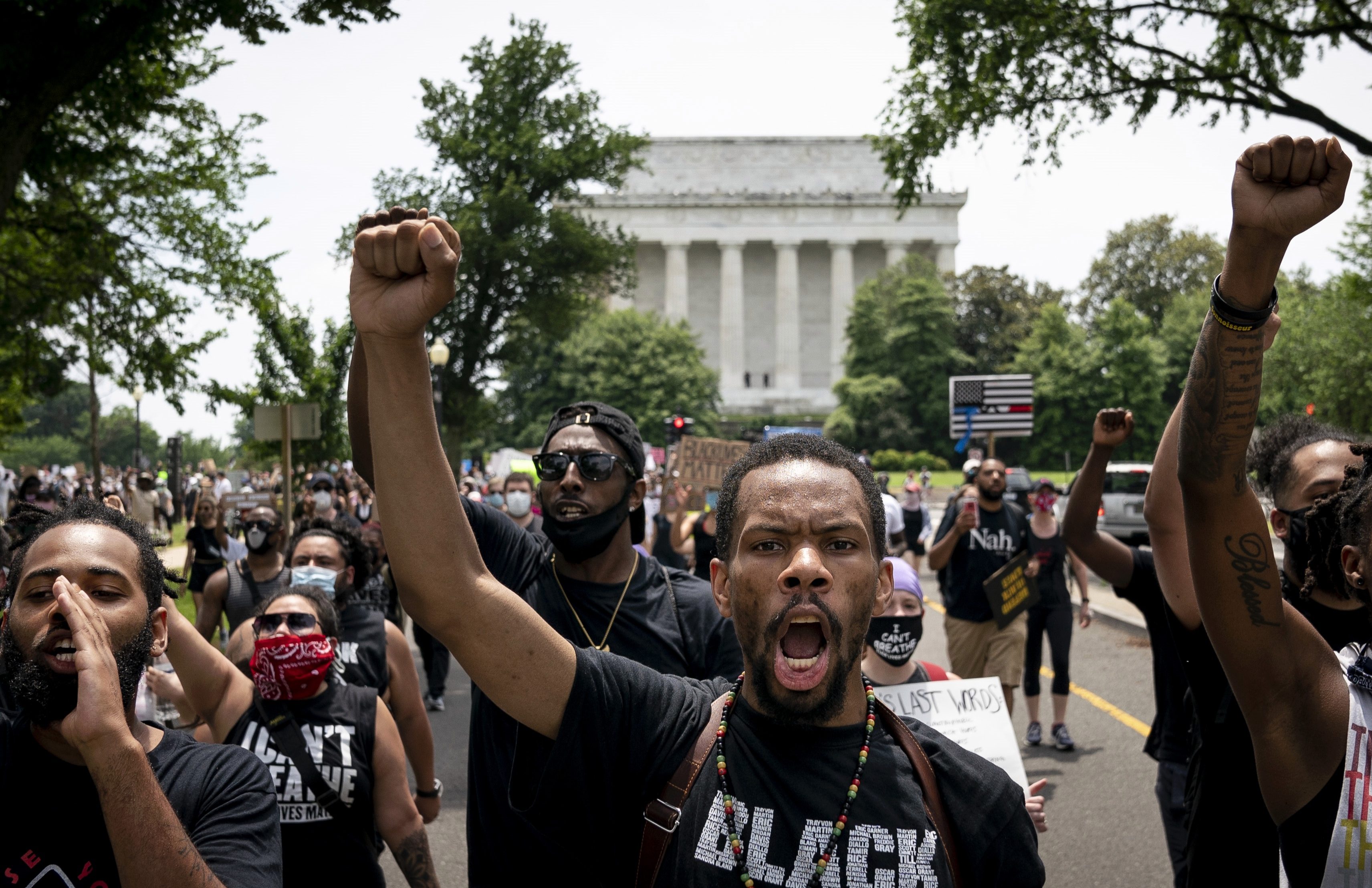  Demonstrators march away from the Lincoln Memorial while protesting against police brutality and racism