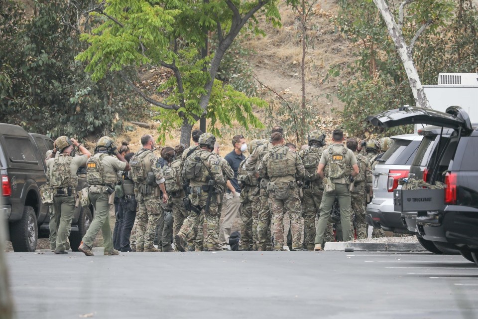 Law enforcement could be seen surrounding at the Los Angeles pad