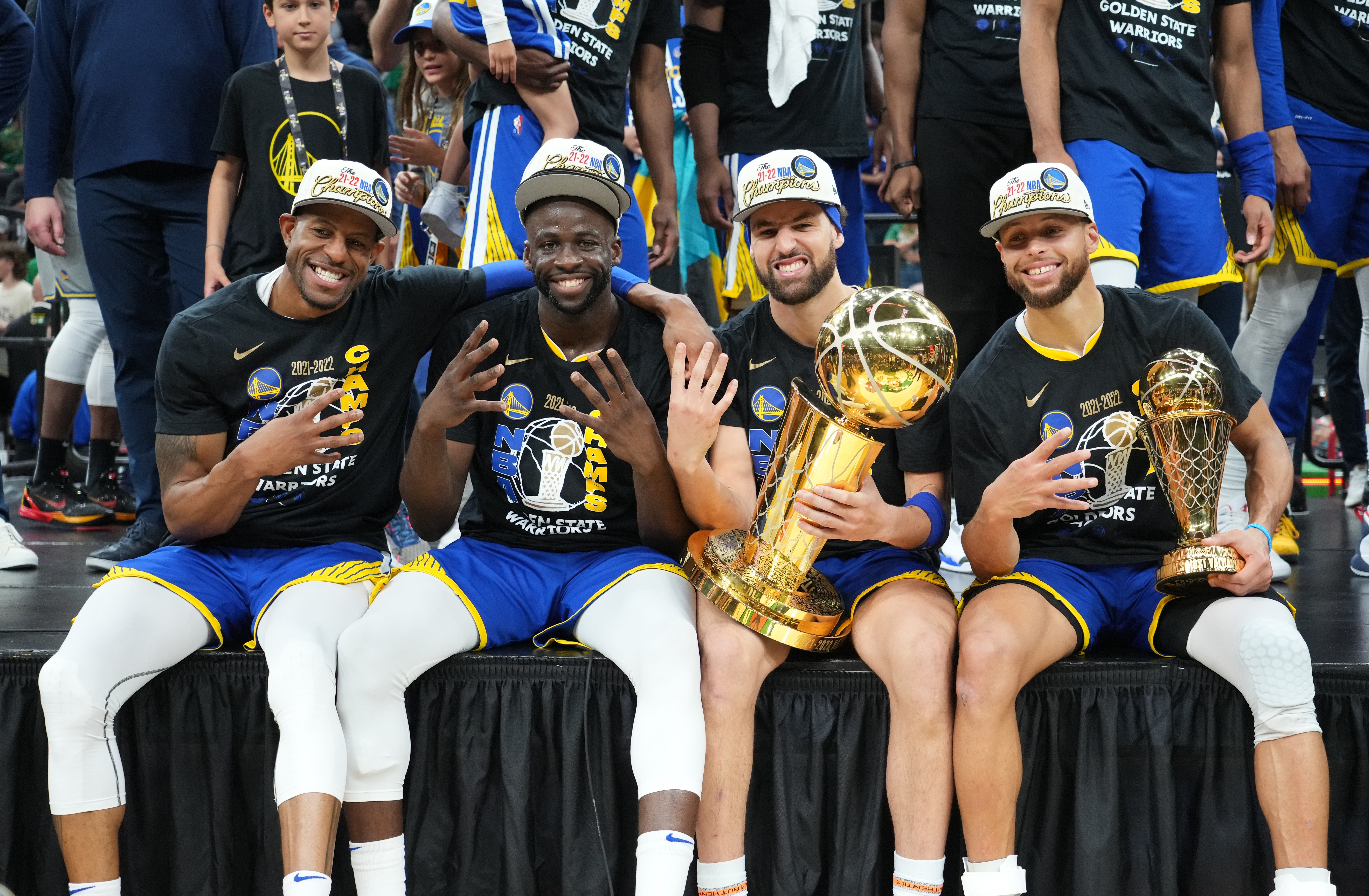 Klay Thompson pictured with his Warriors teammates, Andre Iguodala (first left), Draymond Green (second left), and Steph Curry (far right)