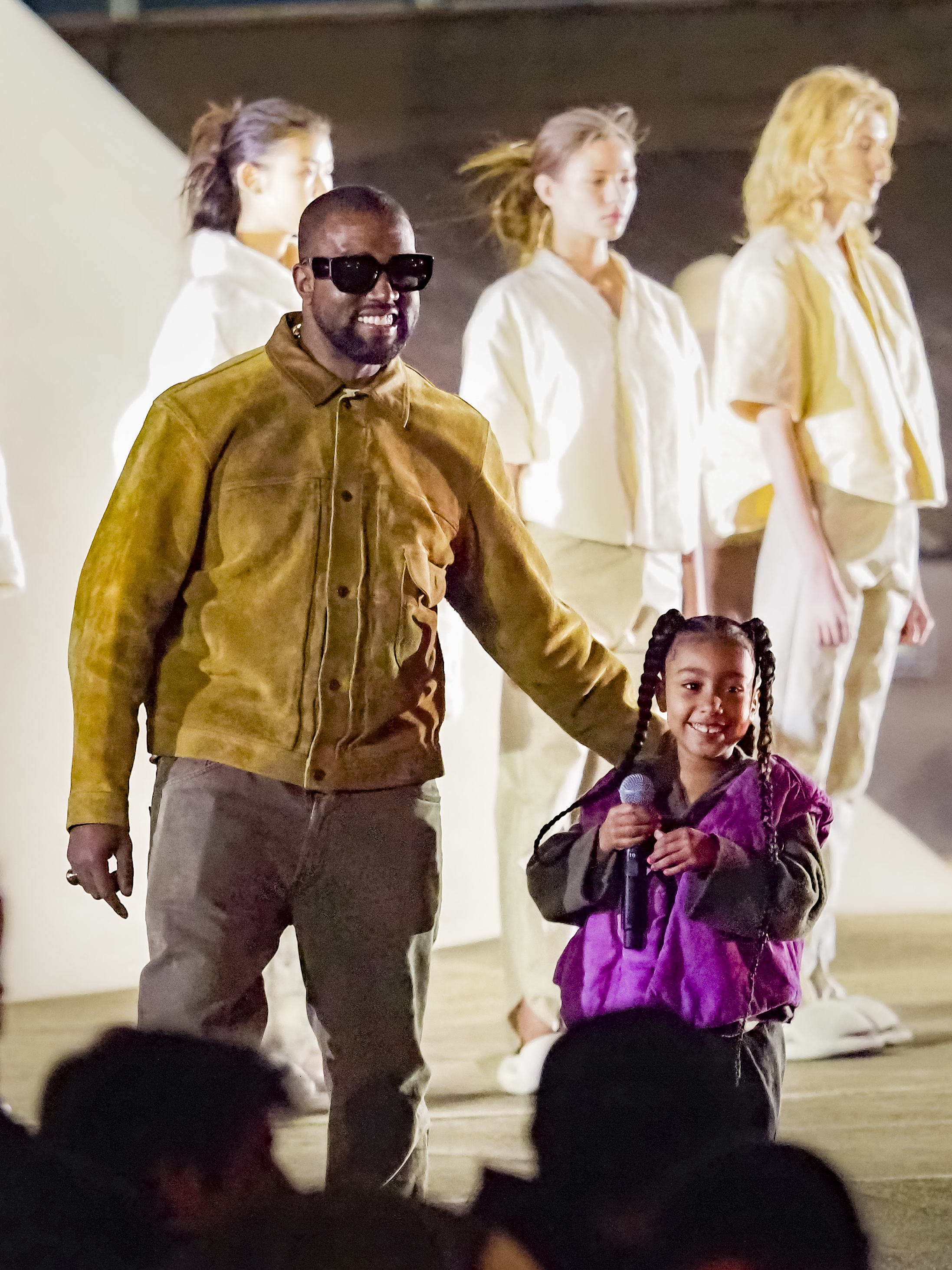 Kanye with his eldest daughter North at the season eight launch of Yeezy's womenswear collection