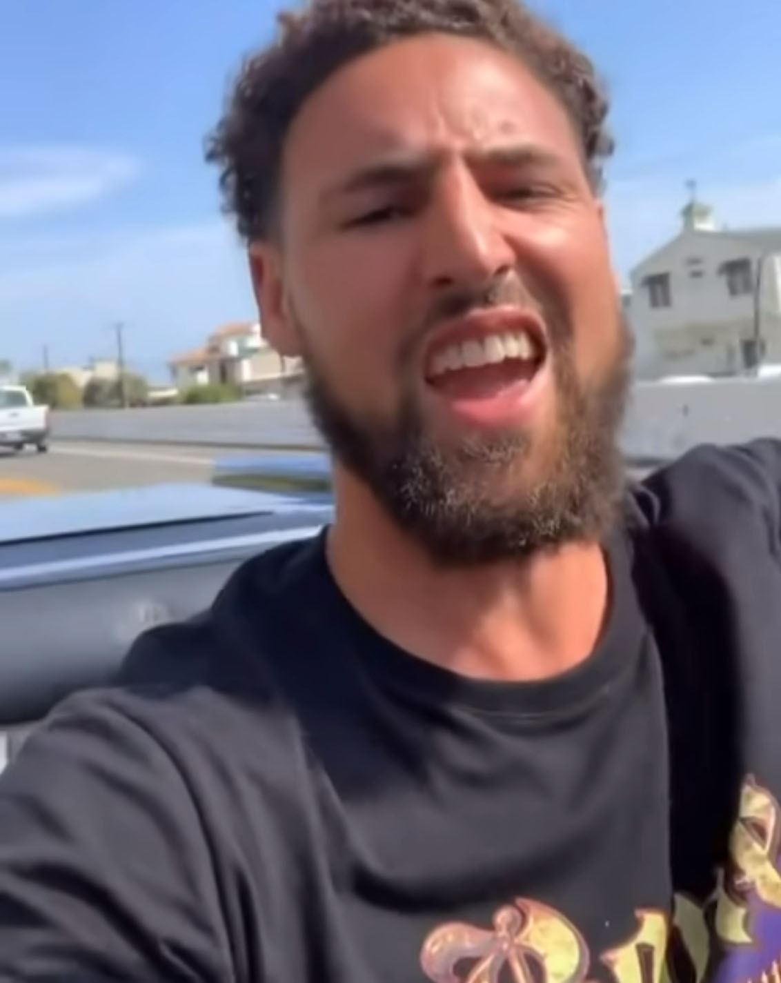 The NBA star films himself driving in one of his convertibles