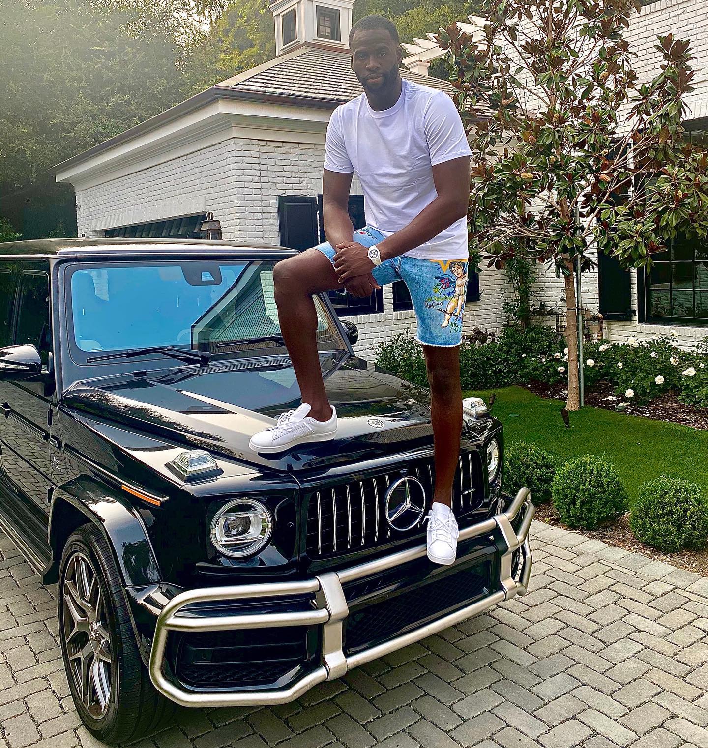 The NBA star poses with his Mercedes-Benz G Class