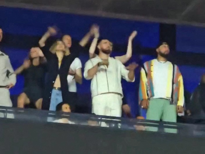 Her boyfriend Travis Kelce, friend Gigi Hadid, and Gigi's boyfriend Bradley Cooper all danced along