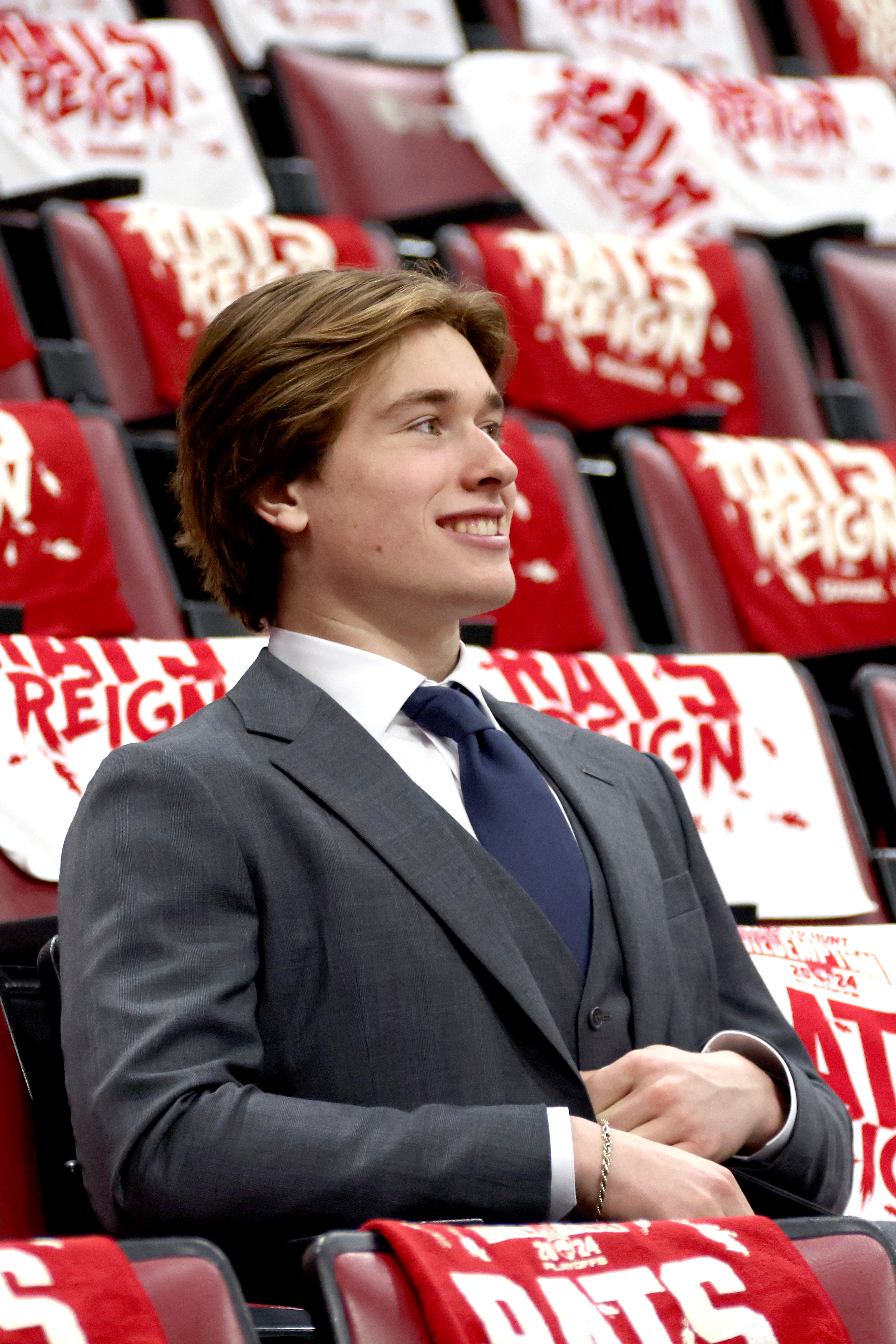 Macklin Celebrini sits in the stands before Game 2 of the 2024 Stanley Cup Final between the Edmonton Oilers and the Florida Panthers