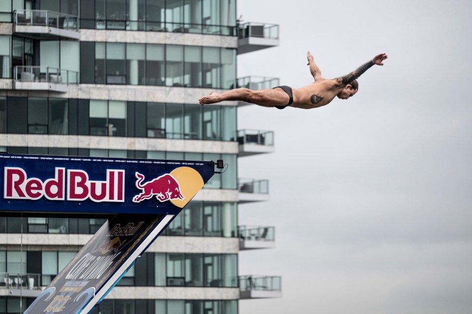 Nikita Fedotov glides through the air after leaping off a 90 ft platform in Boston