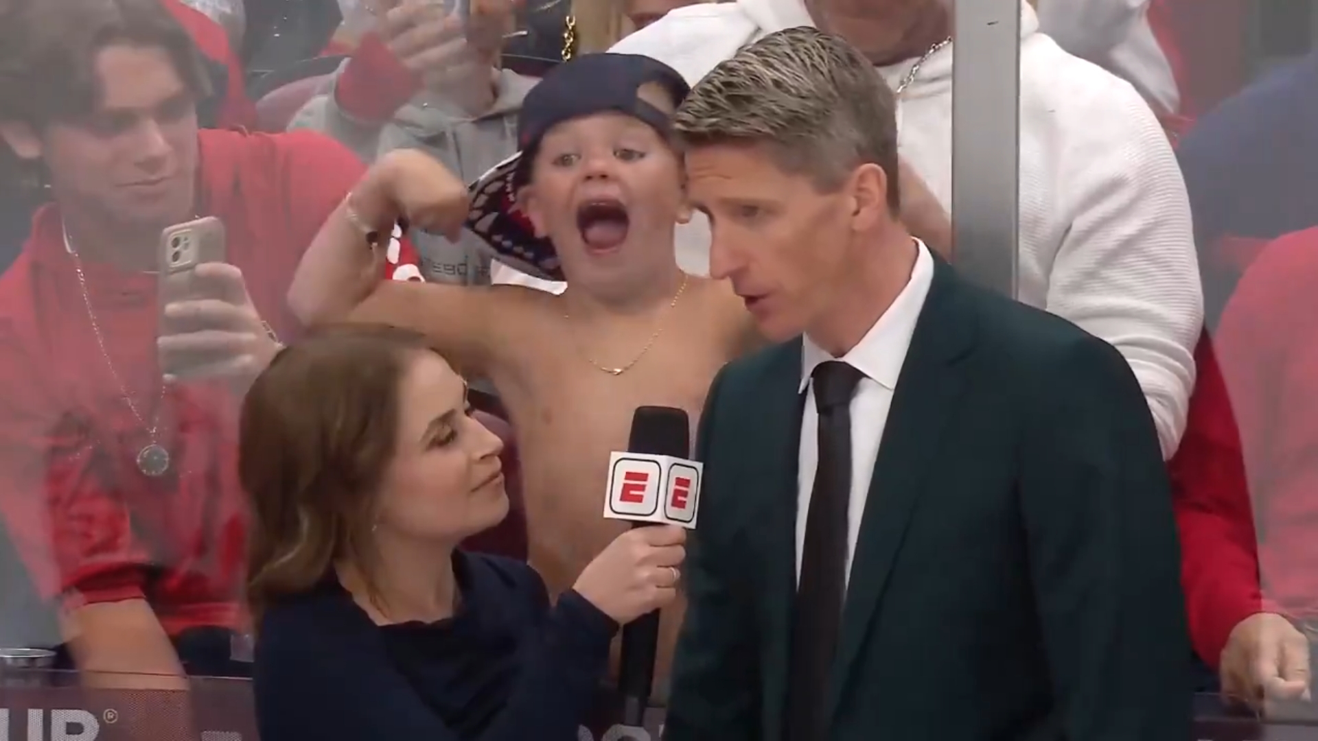 The young fan crashed Edmonton Oilers head coach Kris Knoblauch being interviewed by ESPN reporter Emily Kaplan