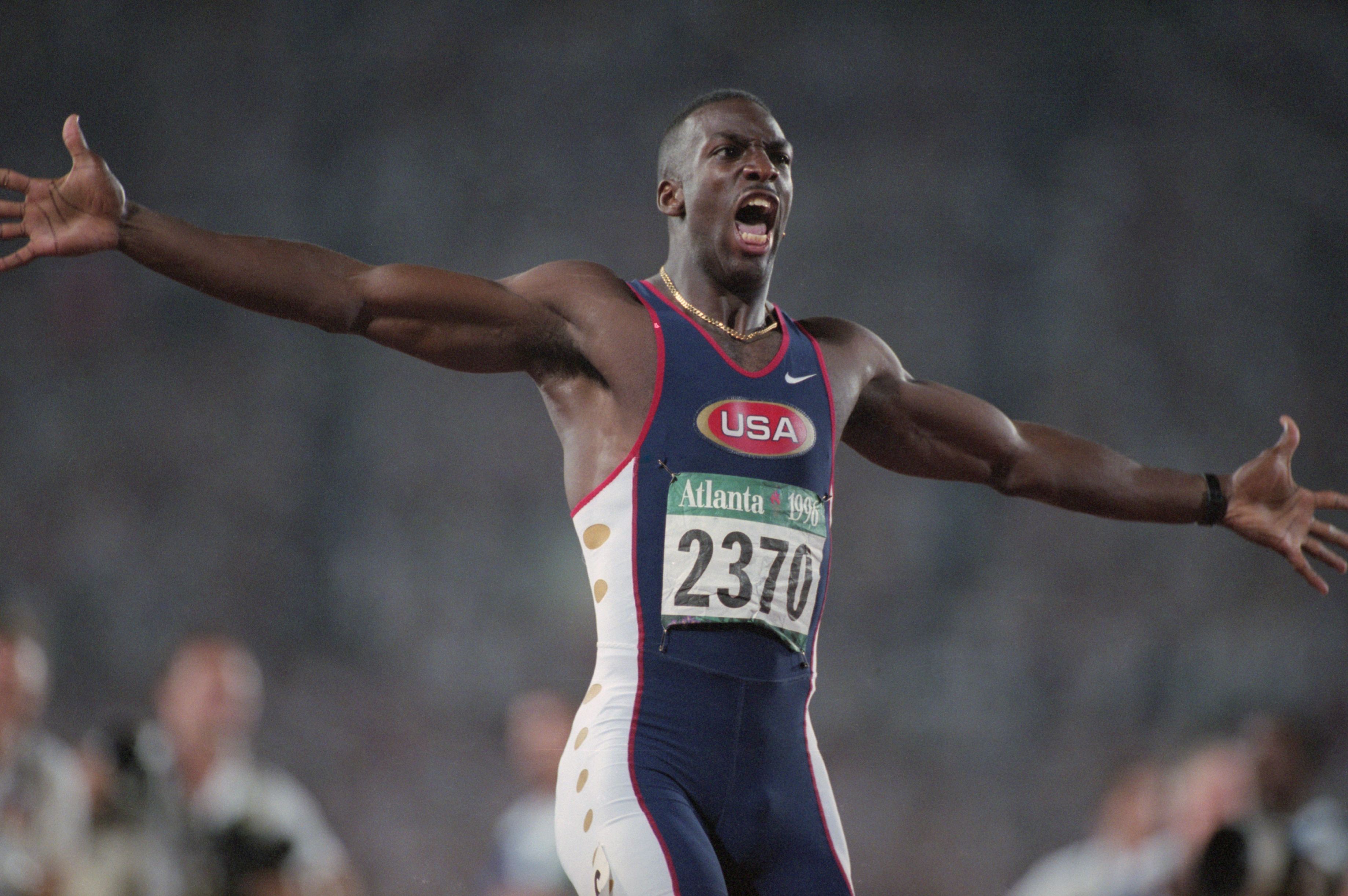 Johnson celebrates his world record and gold medal in the 200m in Atlanta