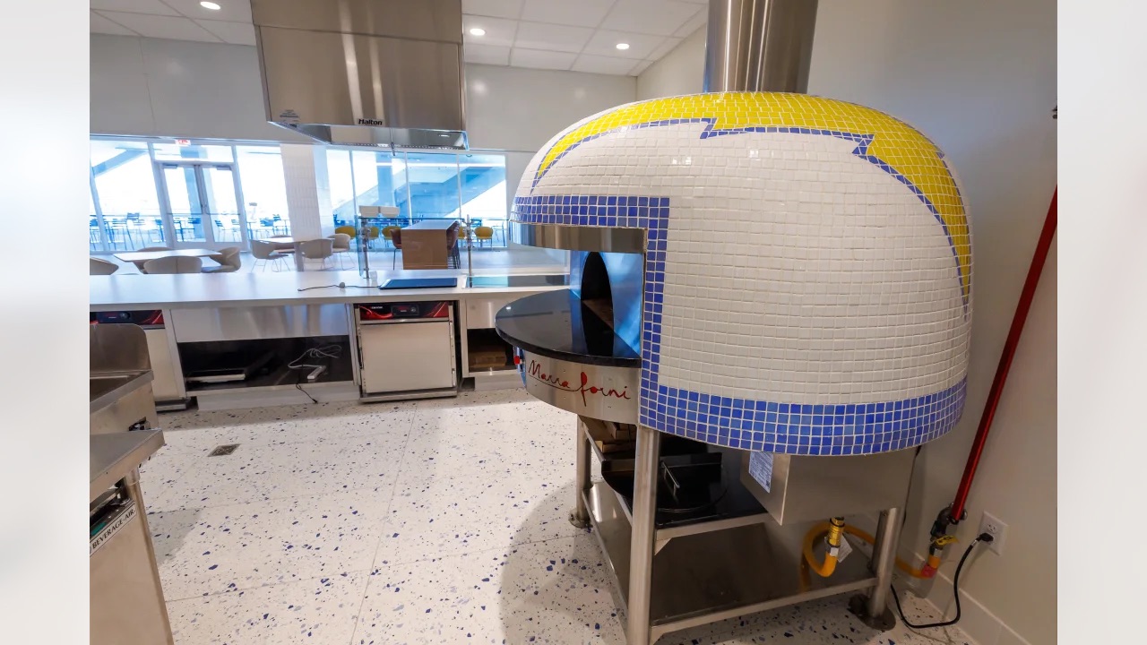 The cafeteria has a helmet-shaped pizza oven