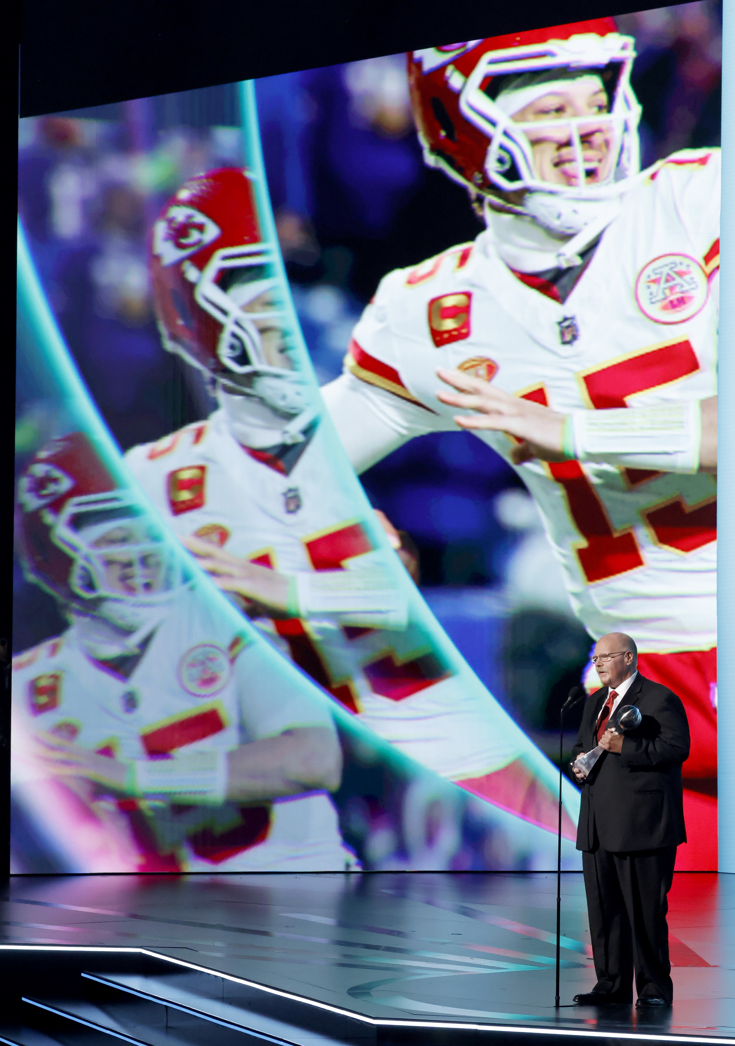 Kansas City Chiefs head coach Andy Reid accepts the Best Athlete Award on Mahomes' behalf