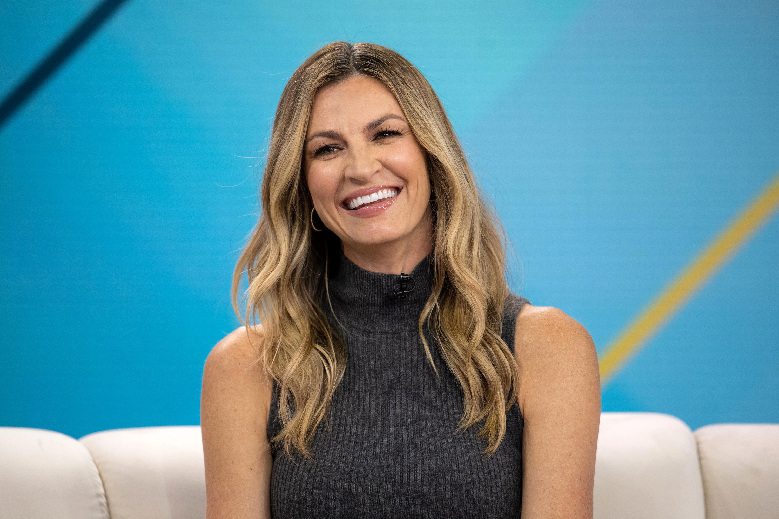 Fox NFL Sunday sideline reporter Erin Andrews poked fun at her colleague Greg Olsen after his picture from Christian McCaffrey's wedding went viral