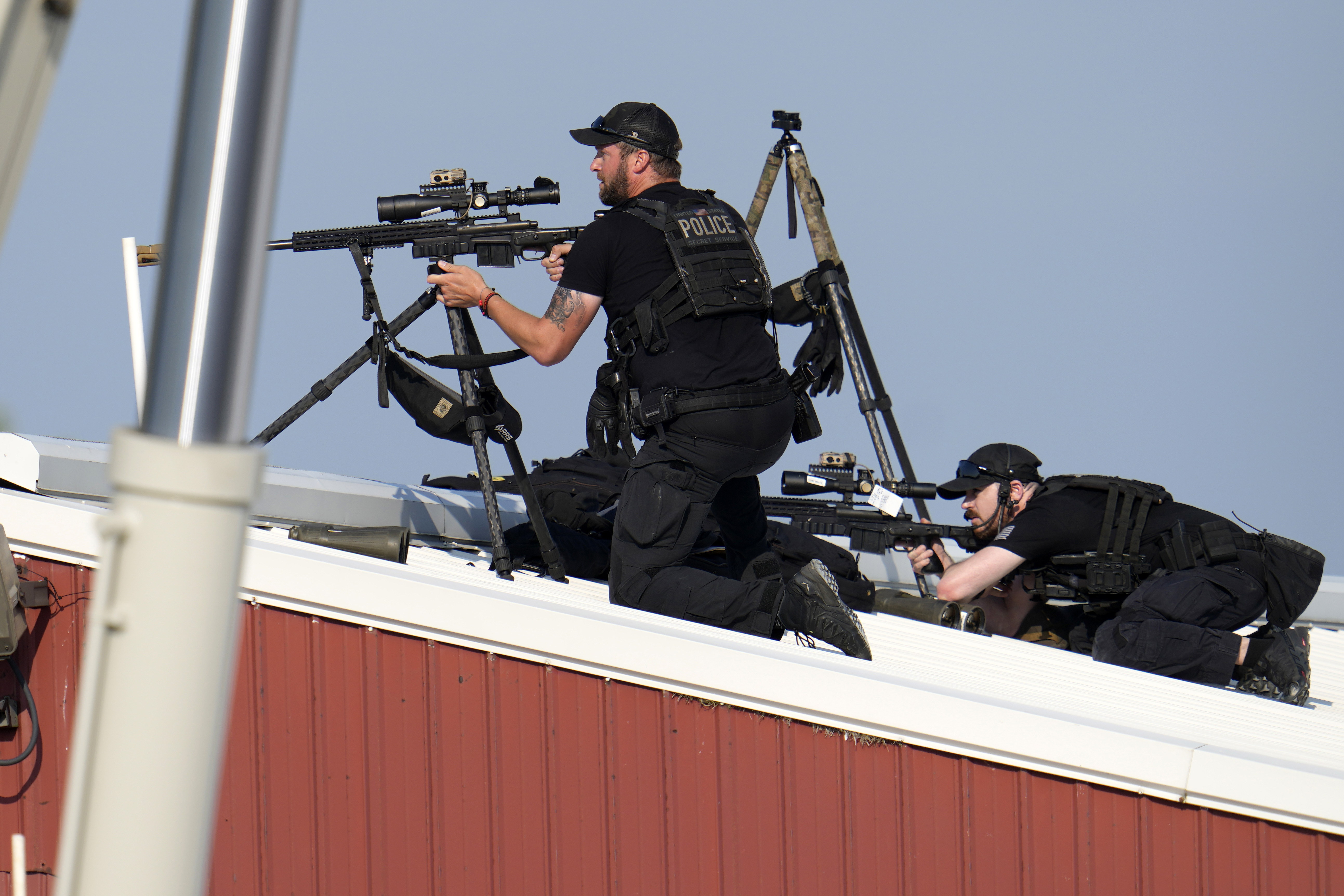 Police snipers return fire after shots were fired at the rally