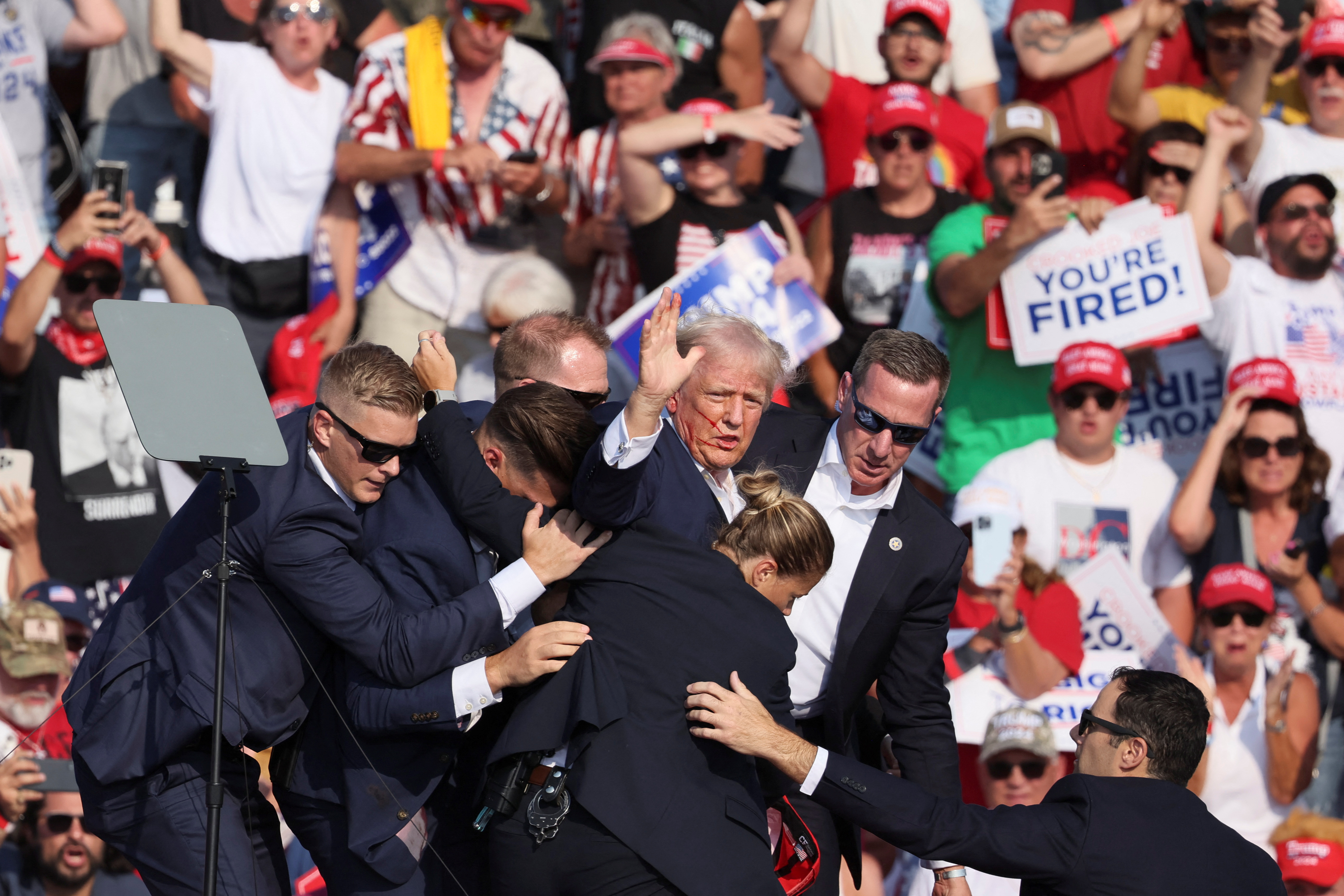 Video of the rally shows the former president being swarmed by Secret Service agents