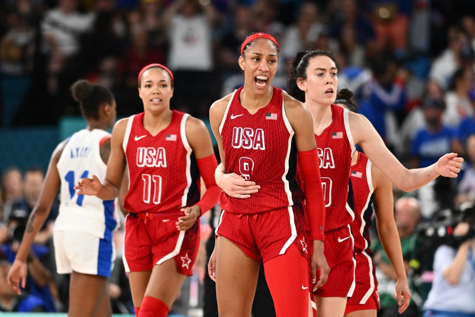 Team USA celebrate victory over France in the women's basketball final