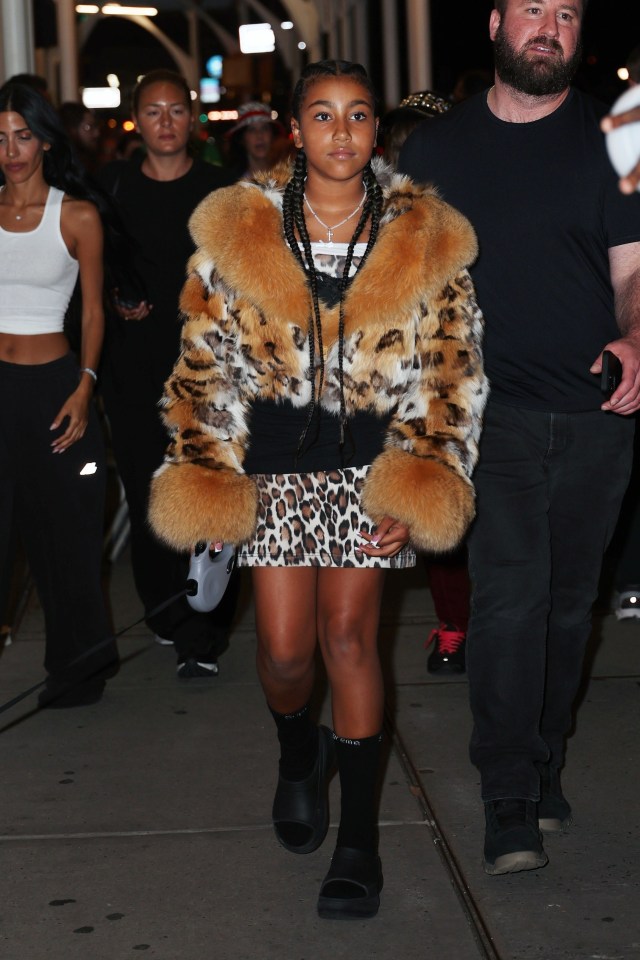 North sported a fox fur jacket over a leopard-print dress for the ice cream outing