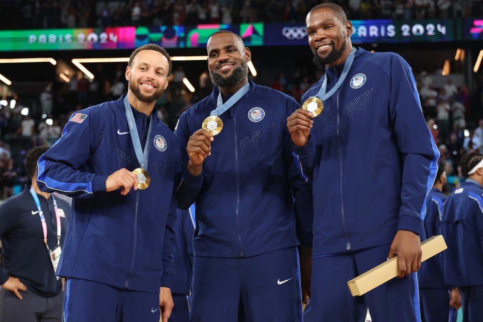 Stephen Curry, LeBron James, and Kevin Durant (left to right) pose with their men's basketball gold medals