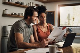 couple discussing stocks or mutual funds