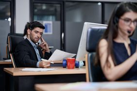 A market maker conducts business at an office