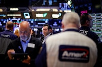 Traders work on the floor at the New York Stock Exchange (NYSE) in New York City, U.S., September 9, 2024.