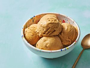 A bowl with five scoops of pumpkin ice cream