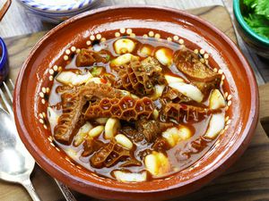 Soup with honeycomb tripe and hominy in broth with chile guajillo base