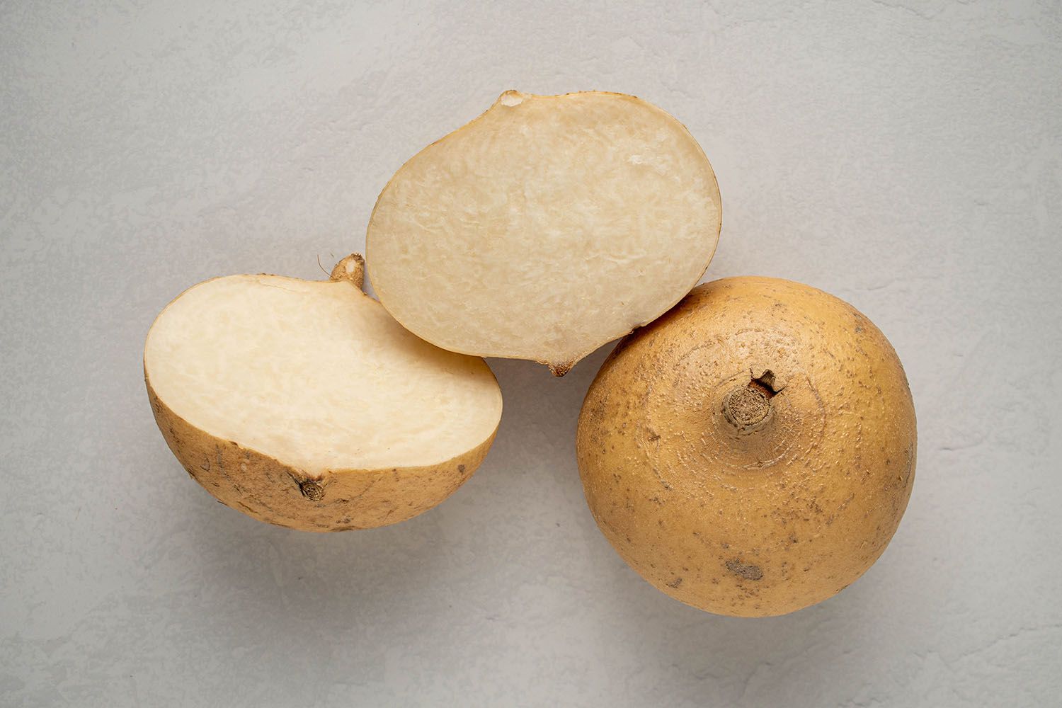 Jicama whole and sliced in half 