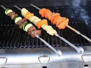 Timeless Steel Lula Kebab Skewers with meat and veggies cooking on a grill