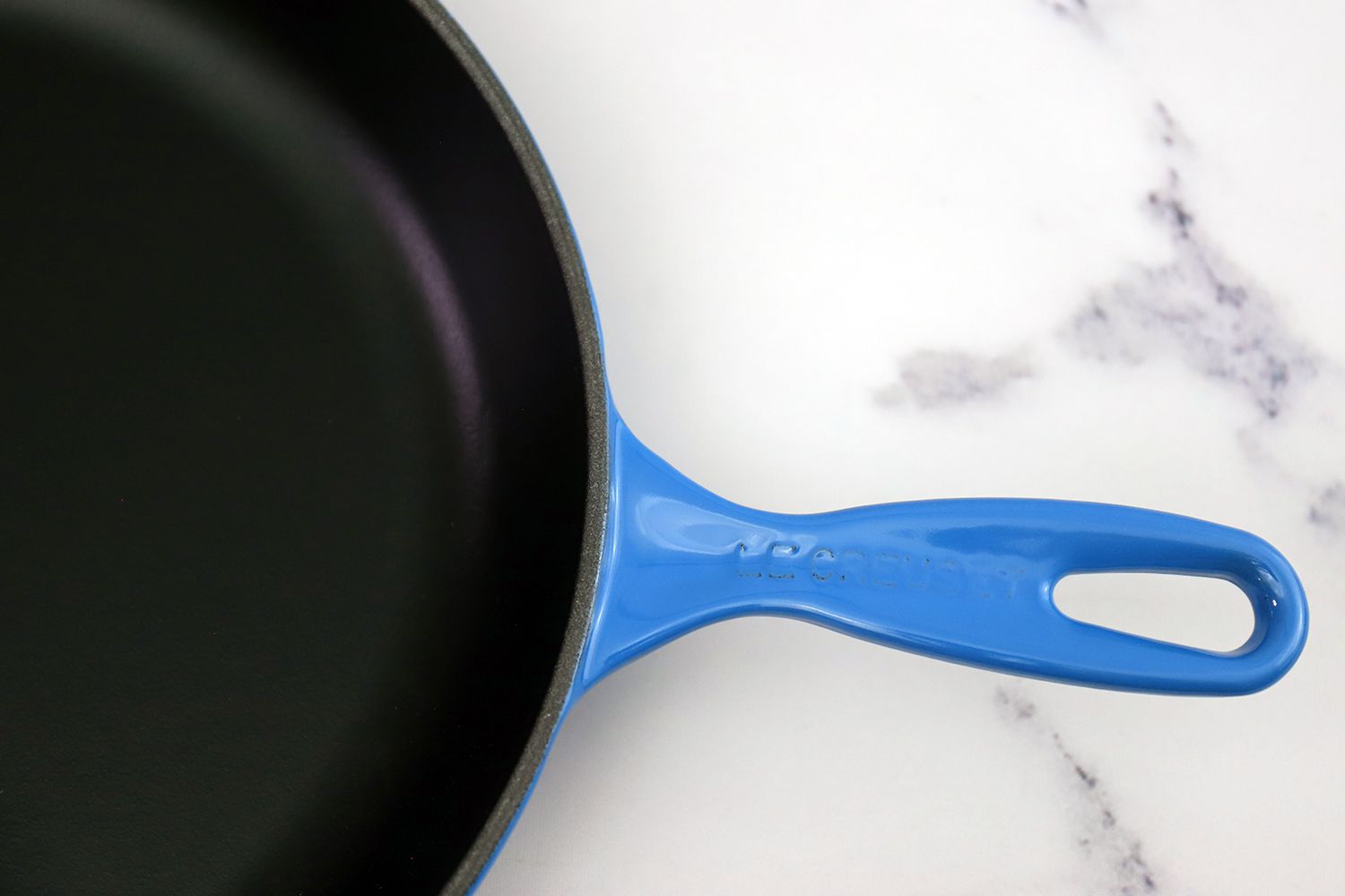 Closeup of the Le Creuset Signature Skillet on a marble counter